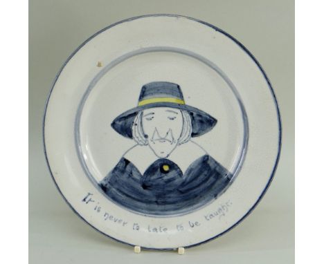 A LLANELLY POTTERY PLATE WITH PORTRAIT OF A PURITAN with amusing grammar mistake, painted in blue and yellow detail, head and