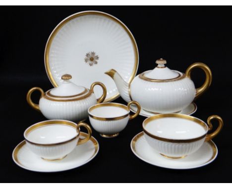 SWANSEA PORCELAIN PARIS FLUTE PART TEA SERVICE comprising teapot and stand, lidded sucrier, two teacups and saucers, breakfas