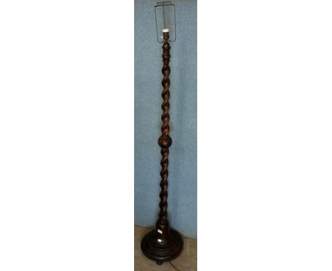 An early 20th Century oak barleytwist standard lamp 