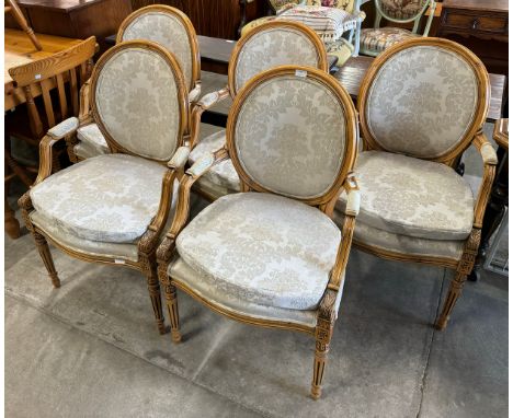 A set of five French Louis XV style walnut and fabric upholstered fauteuil chairs 