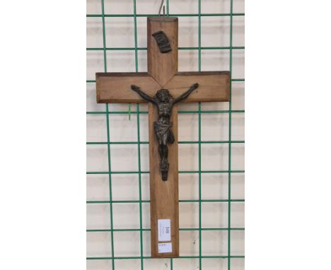 A French fruitwood and simulated bronze crucifix 