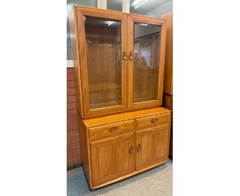 An Ercol Blonde elm Windsor bookcase 