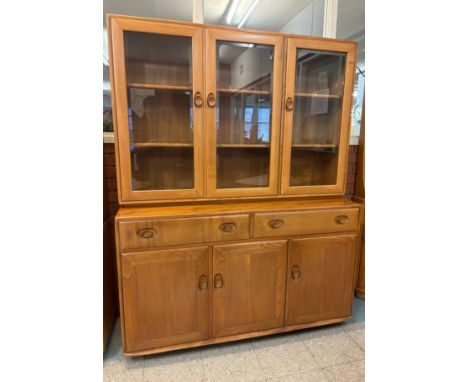 An Ercol Blonde elm Windsor bookcase 