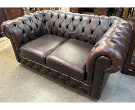 A chestnut brown leather Chesterfield sofa 