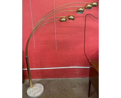 An Italian style gilt metal floor standing arc lamp, on faux marble base 