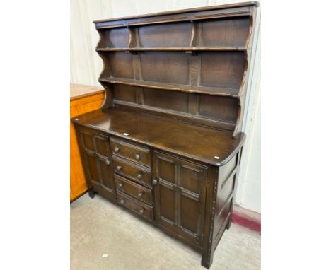 An Ercol dark elm dresser 