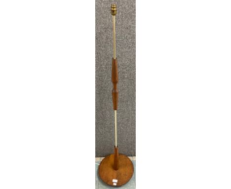A teak and brass standard lamp 