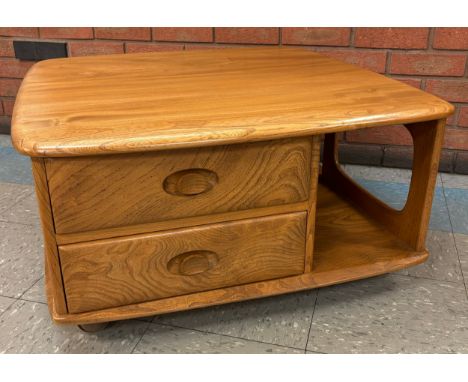 An Ercol Blonde elm Pandoras Box coffee table 