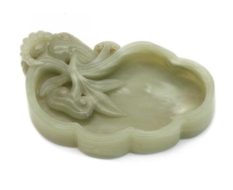 A Chinese jade brush washer, carved with a goat grasping lingzhi in its mouth, the stone of celadon tone, 11.5cm longConditio