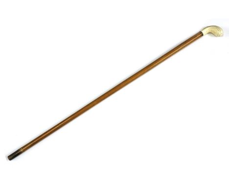An ivory-handled walking stick, late 19th/early 20th century, by Swaine &amp; Adeney of London, with a tapering Malacca shaft