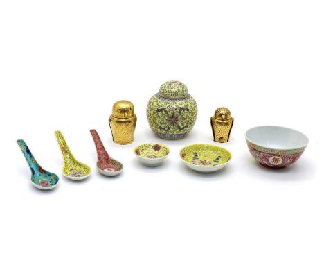 A collection of Chinese famille rose bowls and saucers, decorated with scrolling lotus against a yellow ground, 6.7 to 12.3cm