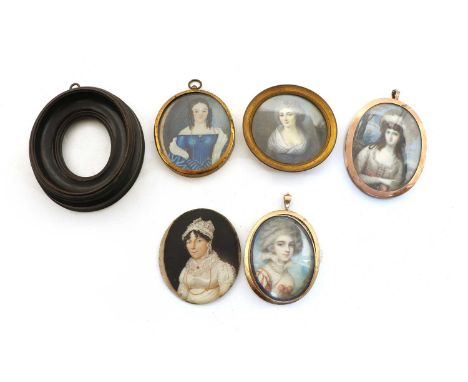 Three portrait miniatures, a portrait miniature of a lady, on ivory, in an oval mount, tests approx 9ct gold, 6.3cm high; an 