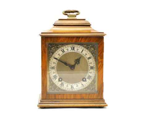 An early 20th century walnut cased two train mantel clock, with a Garrard movement striking on a bell, the dial with a silver