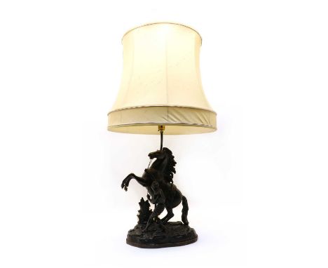 After Guillaume Cousteau, a spelter Marly horse figural lamp, on a wooden base, 31.5cm wide, 15cm deep, 74cm high (to top of 
