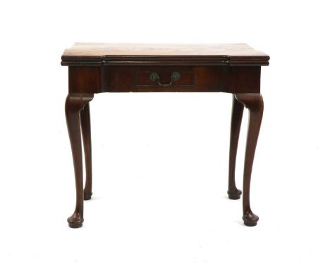 A George II flame mahogany inverted breakfront card table, the foldover top with counter wells and baize lining, with a centr