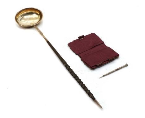 A George III silver toddy ladle, on twisted whalebone handle, London, 1765, 35cm long, together with Victorian silver purse w