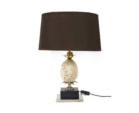 A stone ostrich egg table lamp, in the manner of Maison Charles, with gilt fittings, on a chromed and ebonised plinth, with a