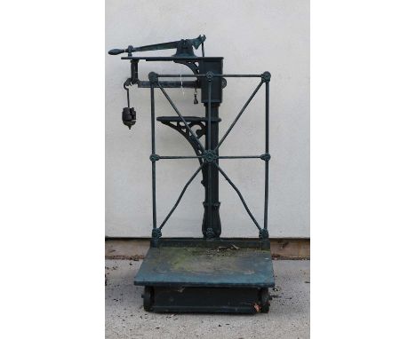 A set of heavy iron platform scales, no. A169, to weigh 5cwt, with GR excise stamp. 122cm high and a small garden rollerCondi