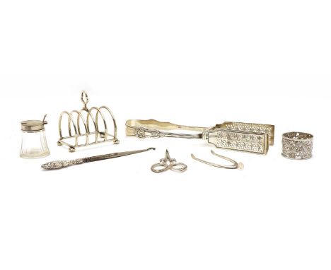 A collection of silver items, to include; a pair of William IV asparagus tongs, hallmarked William Chawner II, London 1833, h