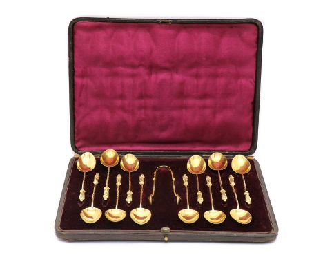 A set of Victorian silver gilt apostle teaspoons and sugar tongs, by Martin, Hall &amp; Co, Sheffield, 1891, within a fitted 