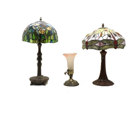 A Tiffany style table lamp, the faux stained glass shade with stylised dragonfly decoration on naturalistic swept base, 46cm 
