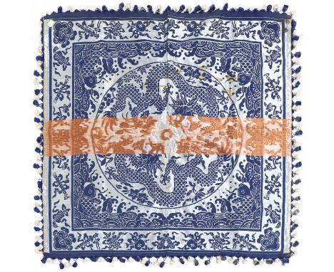 A Chinese embroidery, the centre with two dragons chasing a flaming pearl in a roundel, surrounded by carps and spuming waves