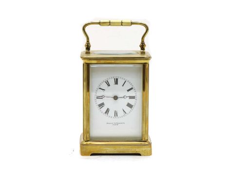 A French brass carriage clock, the dial inscribed 'Robert S Roberts, Paris', striking the half hours on a gong. 18cm to top o