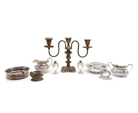 A collection of silver plated items, to include a pair of three branch candelabrum, a mug, a teapot, a sugar bowl, an entree 