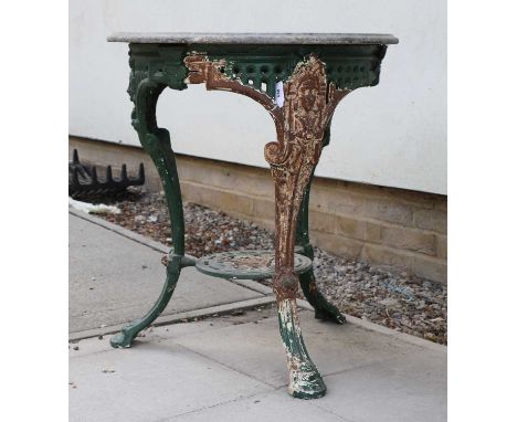 A circular cast iron garden table, the marble top on three leg base with mask decoration, the lower shelf stamped 'Charles Hu