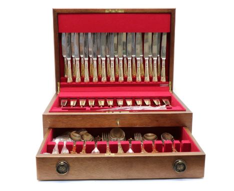 A Walter Trickett mahogany canteen of silver plated flatware, gilt handles with an Art Deco pattern, comprising; 12 dessert f