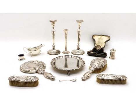 A collection of silver, comprising a pair of filled candlesticks, AC &amp; Ss Ltd, London 1975, 23cm high, a silver waiter, T