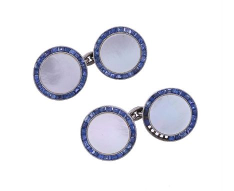 
	
		Y&nbsp;A PAIR OF SAPPHIRE AND MOTHER OF PEARL CUFFLINKS 
		CIRCA 1920
		The polished circular mother of pearl panels wit