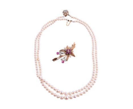 
	
		A 1960S RUBY AND DIAMOND BROOCH AND A CULTURED PEARL NECKLACE
		The 9 carat gold floral spray brooch set with circular c