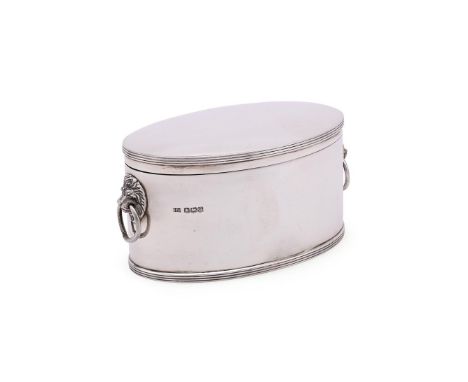 A SILVER OVAL BISCUIT TIN ATKIN BROTHERS, SHEFFIELD 1918 With reeded borders and twin lion mask and loop handles 15cm (6in) l