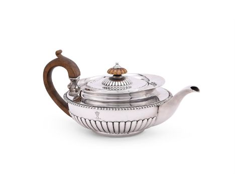 
	
		A GEORGE III SILVER CIRCULAR TEA POT
		WILLIAM BURWASH, LONDON 1815
		The half lobed body with a gadrooned border, a woo