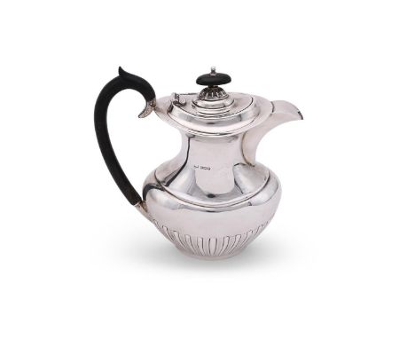 
	
		A VICTORIAN SILVER HALF LOBED OVAL HOT WATER POT
		VINER'S LTD., SHEFFIELD 1895
		With a wooden oval finial and loop han