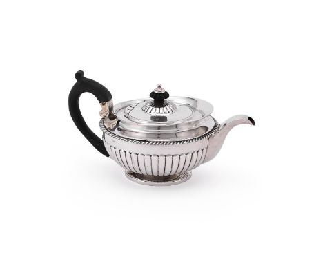 
	
		A GEORGE IV SILVER CIRCULAR TEA POT
		THOMAS BURWASH, LONDON 1821
		With a lobed circular finial and loop handle, the ha