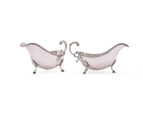 
	
		A PAIR OF SILVER OVAL SAUCE BOATS
		BARKER BROTHERS SILVER LTD., BIRMINGHAM 1960
		With a gadrooned border, leaf capped 