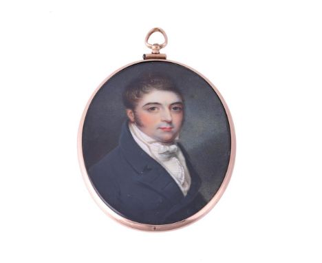 Y&nbsp;A LATE GEORGIAN PORTRAIT MINIATURE OF A GENTLEMAN IN A GOLD SETTING  CIRCA 1810 The oval ivory panel painted with a ge