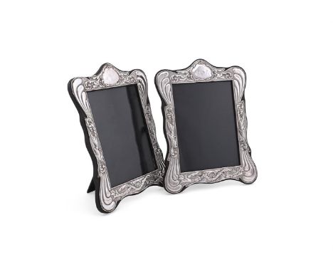 
	
		A PAIR OF SILVER MOUNTED SHAPED RECTANGULAR PHOTO FRAMES
		J &amp; R GRIFFIN LTD., CHESTER 1913
		Embossed with foliate 