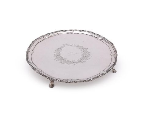 
	
		A GEORGE III SILVER SHAPED CIRCULAR SALVER
		MAKER'S MARK I.C, LONDON 1774
		With a gadrooned border, the centre engrave