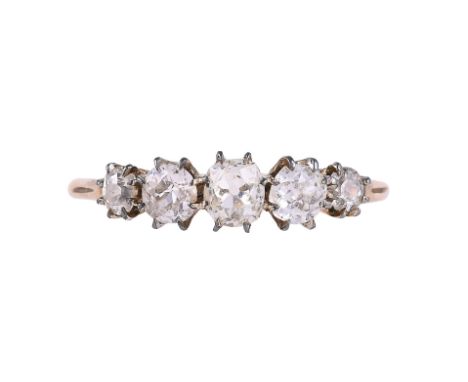 
	
		AN EARLY 20TH FIVE STONE DIAMOND RING
		The graduated old mine cut diamonds in claw settings, approximately 0.85 carats,
