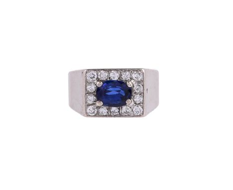 
	
		A SAPPHIRE AND DIAMOND RECTANGULAR CLUSTER RING
		The oval cut sapphire within a surround of brilliant cut diamonds, app