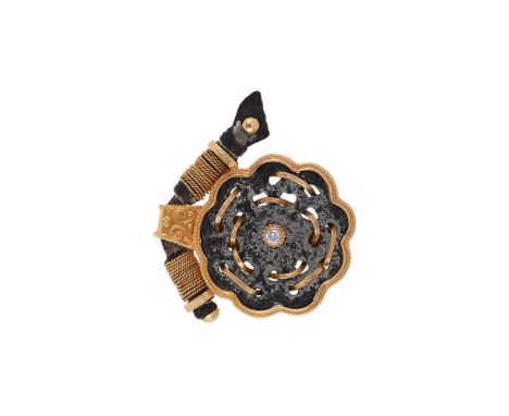
	
		VIVIANE DEBBAS, A GOLD COLOURED AND ANCIENT FRAGMENT BROOCH
		The pierced and lobed circular panel interwoven with reede