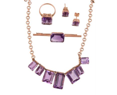 
	
		A MATCHED 1960S AMETHYST SUITE
		Comprising an amethyst fringe necklace, the front with even graduated step cut amethyst