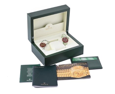 A COLLECTION OF ROLEX ACCESSORIES To include: a green leather watch box, 18 x 13 x 8cm; two chronometer swing tags; a Rolex D