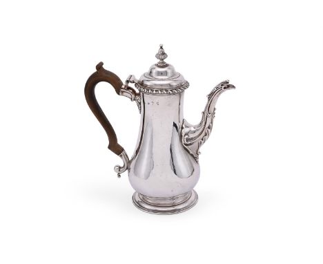 
	
		A GEORGE III SILVER BALUSTER COFFEE POT
		MAKER'S MARK OBSCURED, LONDON 1762
		With a bell shaped finial to the ogee dom