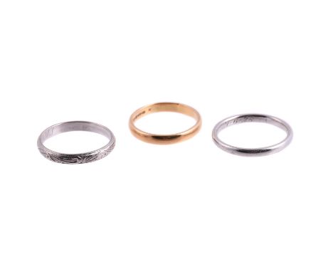 
	
		A TRIO OF BAND RINGS
		The first by Charles Green &amp; Son, the 18 carat gold band with engraved scrolled decoration, B