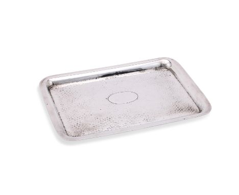 
	
		AN EDWARDIAN SILVER OBLONG TRAY
		HENRY MATTHEWS, BIRMINGHAM 1903
		With a hammered surface and an oval vacant reserve
	