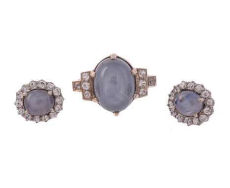 
	
		A STAR SAPPHIRE AND WHITE STONE RING AND CLUSTER EARRINGS
		The ring with a large pale greyish blue star sapphire, to st